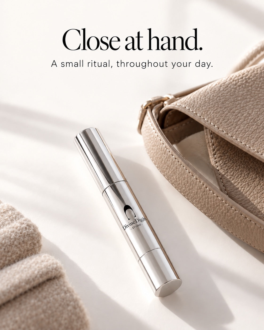 Silver pen beside a handbag